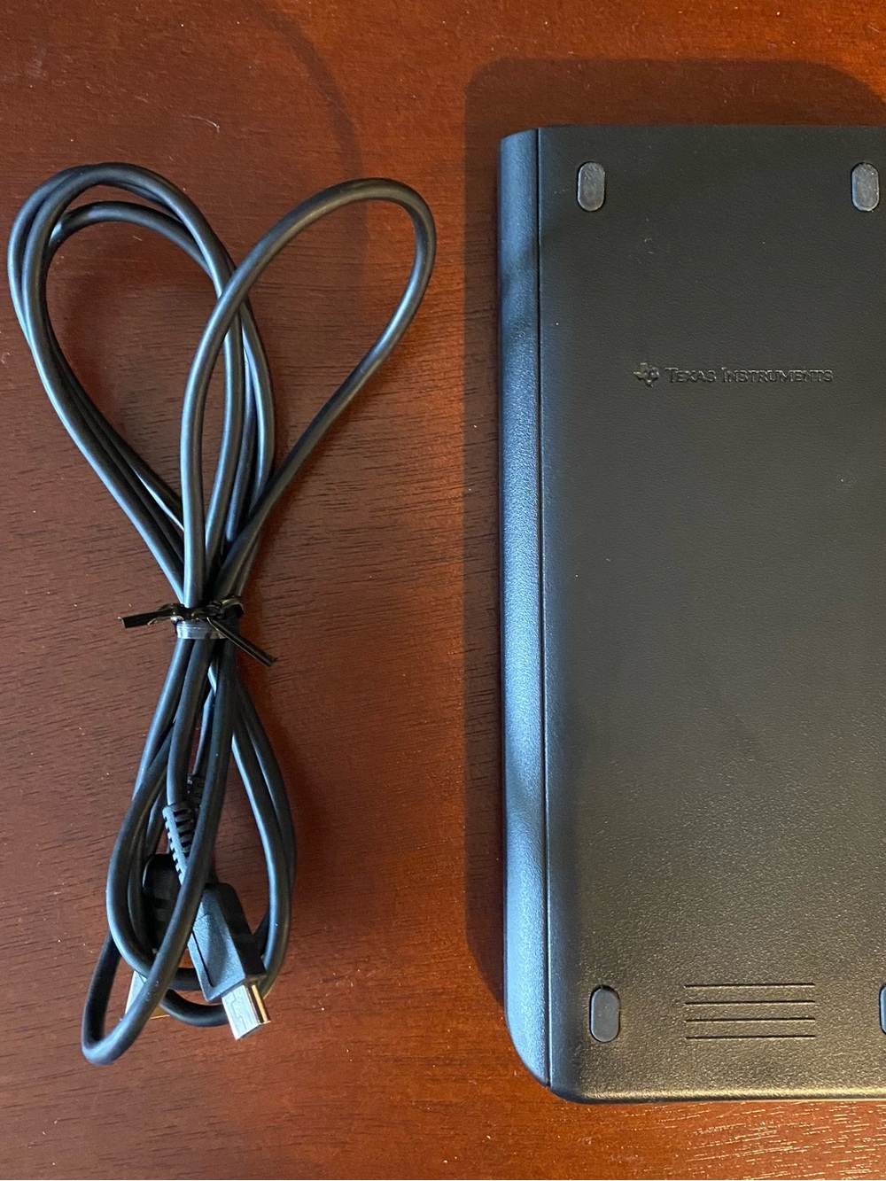 Texas Instruments Graphing Calculator with Blue Accents and Black Body - Picture 2 of 8